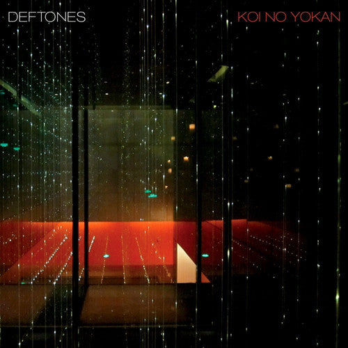 Album cover for 'Koi No Yokan' by Deftones with a reflective surface and red interior.